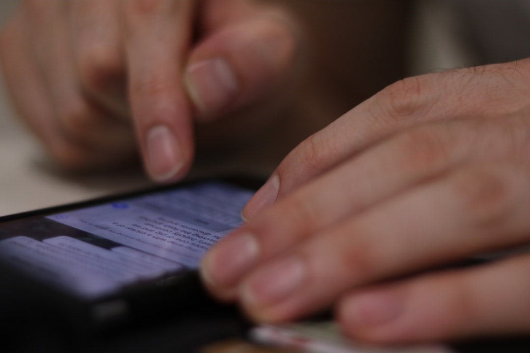 a-close-up-of-a-person-using-a-cell-phone-9iyhfduwjnk
